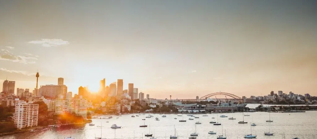 Sydney skyline symbolising Australian property market", "Graph overlay on property indicating capital gains tax implications